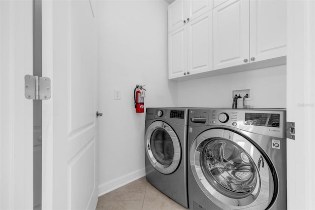 8970 Azalea Sands Ln Unit 2302, Davenport, FL 33896 - laundry room featuring cabinet space, washing machine and clothes dryer, and light tile patterned floors