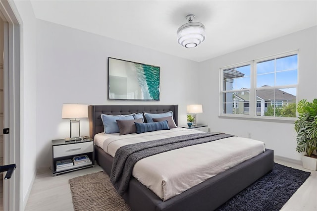 3280 Soho St Unit 306, Orlando, FL 32835 - bedroom featuring light wood finished floors and baseboards