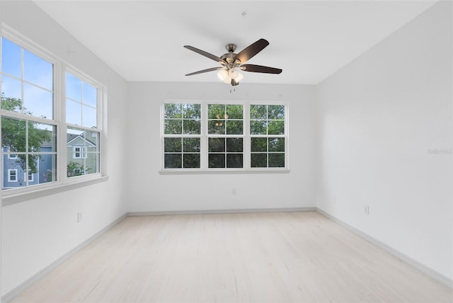 3280 Soho St Unit 306, Orlando, FL 32835 - spare room with wood finished floors and ceiling fan