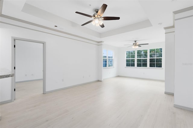 3280 Soho St Unit 306, Orlando, FL 32835 - unfurnished room with a tray ceiling, light wood-type flooring, and ceiling fan