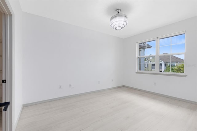 3280 Soho St Unit 306, Orlando, FL 32835 - unfurnished room with light wood-style flooring and baseboards