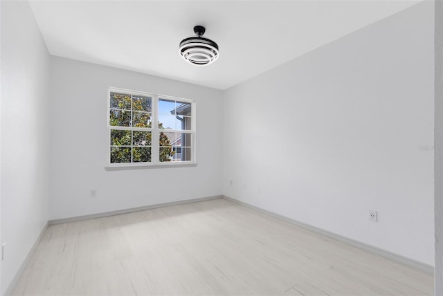 3280 Soho St Unit 306, Orlando, FL 32835 - spare room with light wood-type flooring and baseboards