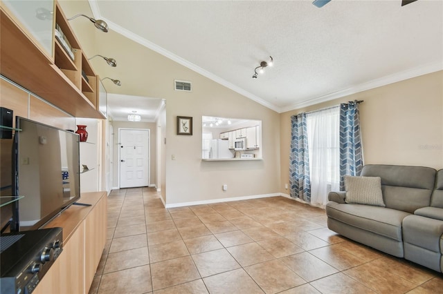 145 Lakeside Cir, Sanford, FL 32773 - living area with lofted ceiling, light tile patterned floors, and crown molding