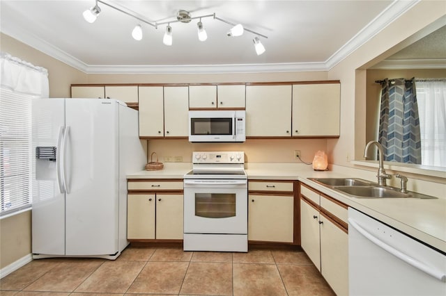 145 Lakeside Cir, Sanford, FL 32773 - kitchen with white appliances, light countertops, cream cabinetry, and ornamental molding