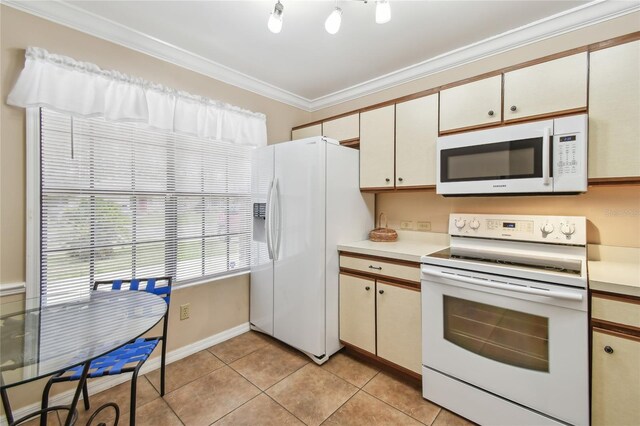145 Lakeside Cir, Sanford, FL 32773 - kitchen with white appliances, crown molding, light countertops, and light tile patterned flooring