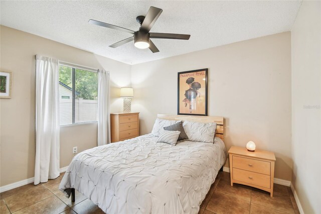145 Lakeside Cir, Sanford, FL 32773 - tiled bedroom with a textured ceiling and ceiling fan