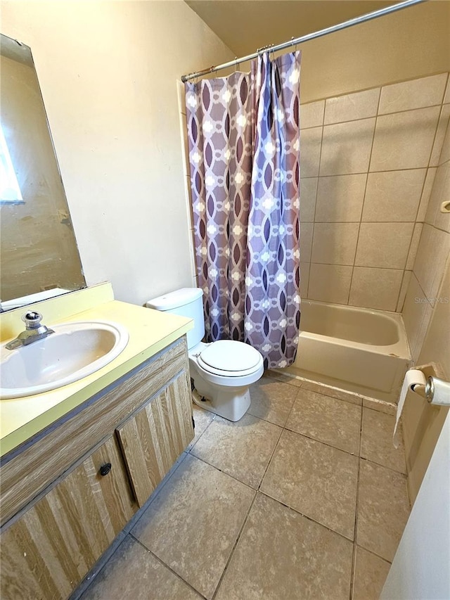 bathroom featuring tile patterned floors, vanity, and shower / bath combo with shower curtain