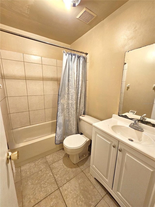 full bath featuring vanity, shower / tub combo with curtain, and tile patterned floors