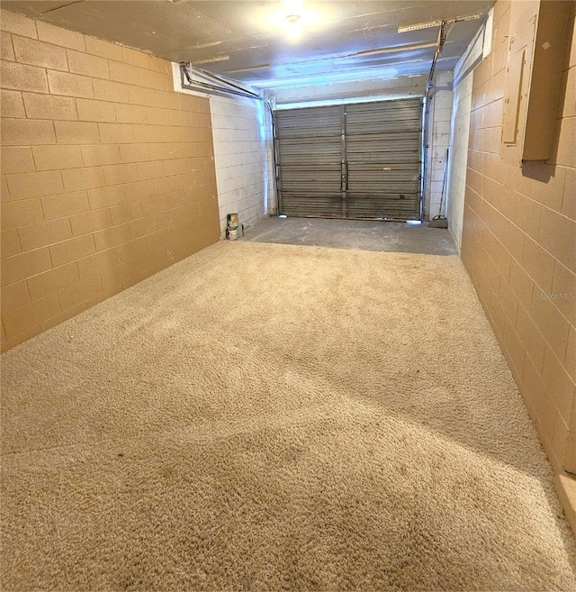 garage featuring concrete block wall