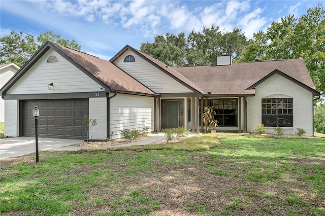 762 Lake Como Dr, Lake Mary, FL 32746 - view of front of house with a chimney, an attached garage, a front yard, concrete driveway, and brick siding