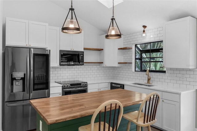 762 Lake Como Dr, Lake Mary, FL 32746 - kitchen featuring appliances with stainless steel finishes, wooden counters, open shelves, a kitchen island, and white cabinets