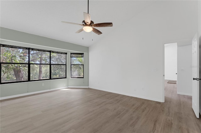 762 Lake Como Dr, Lake Mary, FL 32746 - empty room featuring a ceiling fan, light wood finished floors, and high vaulted ceiling