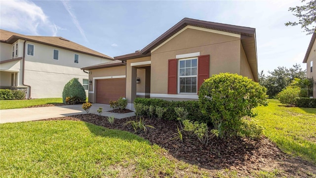 922 Suffolk Pl, Davenport, FL 33896 - view of front facade featuring concrete driveway, stucco siding, an attached garage, and a front yard