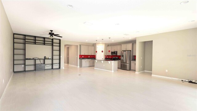 922 Suffolk Pl, Davenport, FL 33896 - unfurnished living room featuring a ceiling fan and recessed lighting