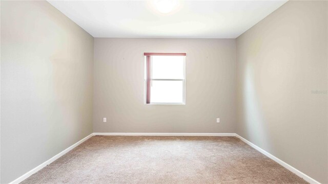 922 Suffolk Pl, Davenport, FL 33896 - carpeted empty room featuring baseboards