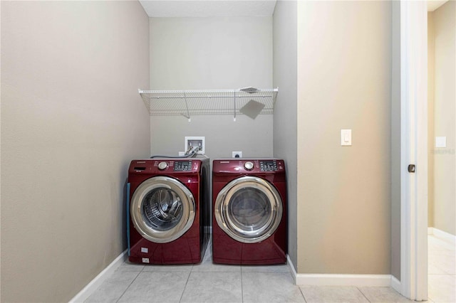 922 Suffolk Pl, Davenport, FL 33896 - laundry room featuring washer and clothes dryer and tile patterned floors