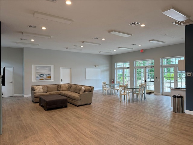 922 Suffolk Pl, Davenport, FL 33896 - living area with light wood-style flooring, french doors, and recessed lighting