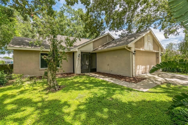2002 Culpepper Dr, Brandon, FL 33511 - view of front of house featuring stucco siding, a garage, a front yard, driveway, and a shingled roof
