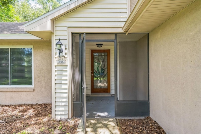 2002 Culpepper Dr, Brandon, FL 33511 - entrance to property featuring stucco siding and roof with shingles