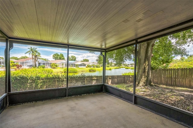 2002 Culpepper Dr, Brandon, FL 33511 - unfurnished sunroom with a water view, plenty of natural light, and a residential view