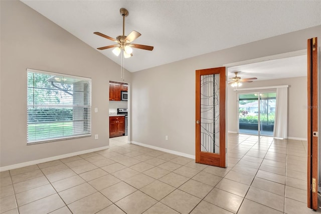 2002 Culpepper Dr, Brandon, FL 33511 - spare room with a ceiling fan, light tile patterned flooring, and vaulted ceiling