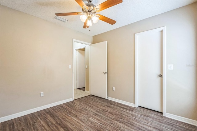 2002 Culpepper Dr, Brandon, FL 33511 - unfurnished bedroom with wood finished floors and ceiling fan