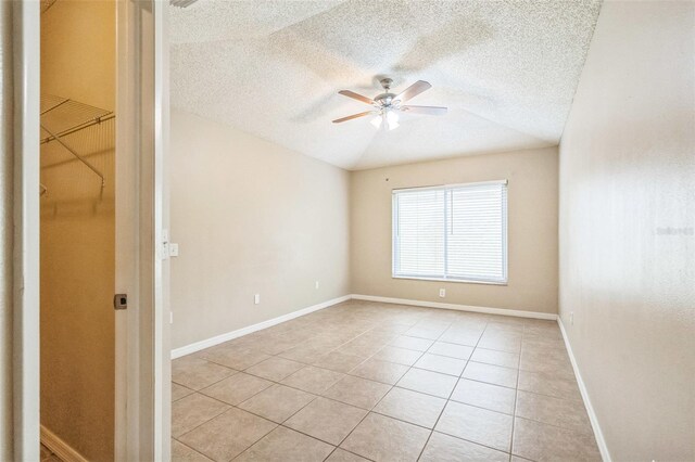 2002 Culpepper Dr, Brandon, FL 33511 - empty room with light tile patterned floors, a ceiling fan, and a textured ceiling
