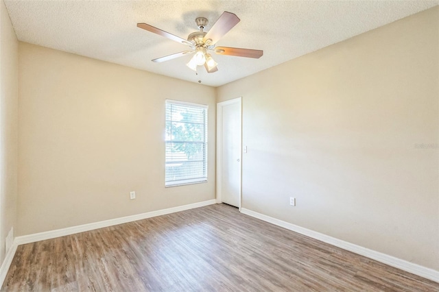 2002 Culpepper Dr, Brandon, FL 33511 - spare room featuring wood finished floors, ceiling fan, and a textured ceiling