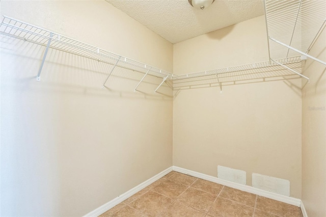 2002 Culpepper Dr, Brandon, FL 33511 - walk in closet with light tile patterned floors