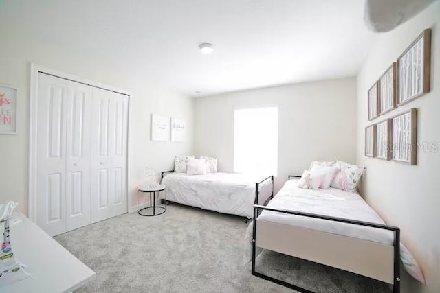 4973 Windermere Ave, Kissimmee, FL 34746 - carpeted bedroom with a closet