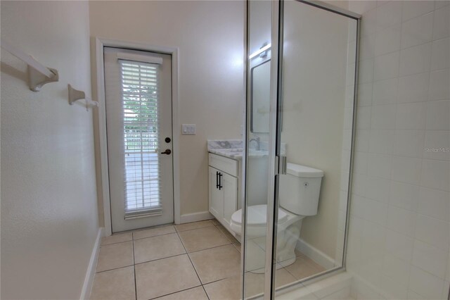1679 Shadowmoss Cir, Lake Mary, FL 32746 - full bathroom with vanity, tile patterned floors, and a shower with shower door