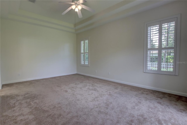 1679 Shadowmoss Cir, Lake Mary, FL 32746 - carpeted empty room with a ceiling fan and a tray ceiling