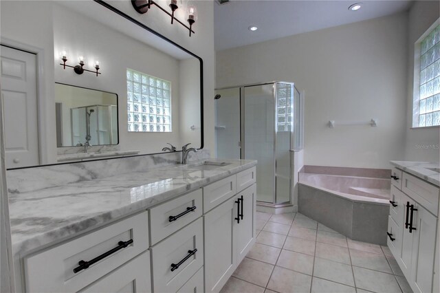 1679 Shadowmoss Cir, Lake Mary, FL 32746 - bathroom with a shower stall, vanity, a bath, tile patterned floors, and recessed lighting