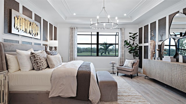 14375 Hammock Oak St, Parrish, FL 34219 - bedroom featuring a chandelier, wood finished floors, crown molding, a raised ceiling, and recessed lighting