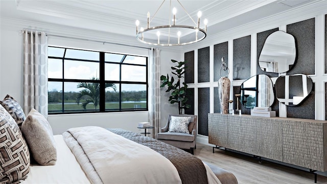14375 Hammock Oak St, Parrish, FL 34219 - bedroom featuring ornamental molding, a chandelier, and wood finished floors