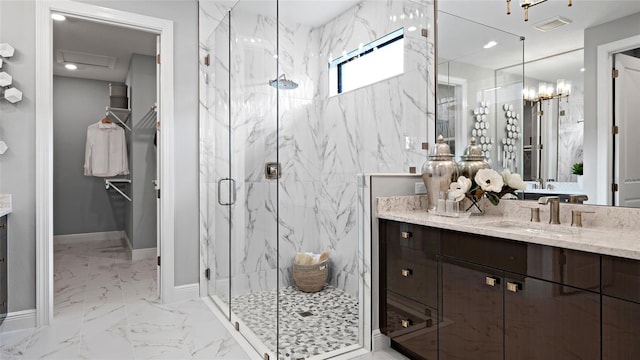 14375 Hammock Oak St, Parrish, FL 34219 - full bath with a marble finish shower, vanity, marble finish floors, and a chandelier
