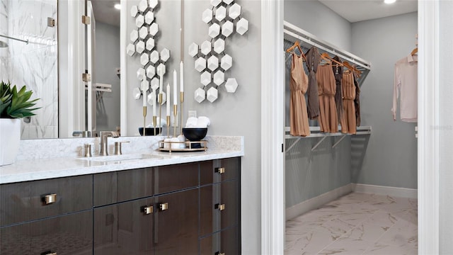 14375 Hammock Oak St, Parrish, FL 34219 - bathroom with marble finish flooring, vanity, and a spacious closet