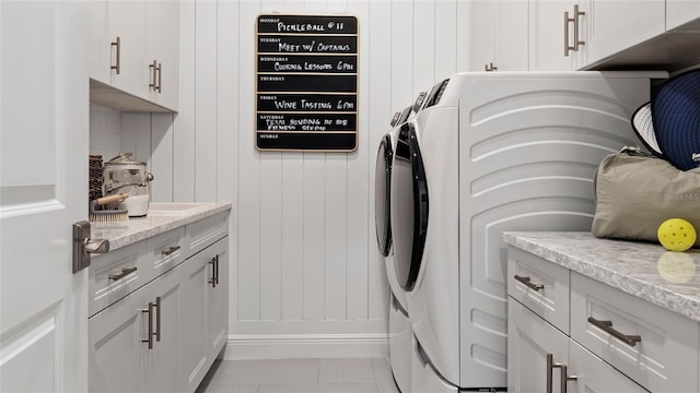14375 Hammock Oak St, Parrish, FL 34219 - laundry room featuring washing machine and clothes dryer and cabinet space