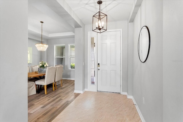 2781 Sand Oak Loop, Apopka, FL 32712 - foyer entrance with a chandelier and a tray ceiling