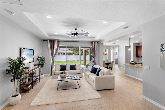 2781 Sand Oak Loop, Apopka, FL 32712 - living area featuring ceiling fan, recessed lighting, and a raised ceiling