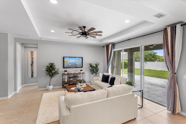 2781 Sand Oak Loop, Apopka, FL 32712 - living room featuring light tile patterned flooring, a raised ceiling, recessed lighting, and ceiling fan