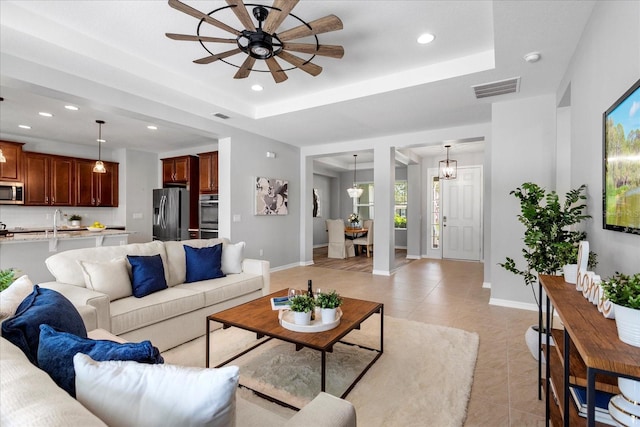 2781 Sand Oak Loop, Apopka, FL 32712 - living area with a ceiling fan, recessed lighting, light tile patterned floors, and a raised ceiling