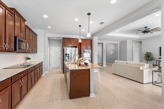 2781 Sand Oak Loop, Apopka, FL 32712 - kitchen featuring appliances with stainless steel finishes, backsplash, light stone countertops, recessed lighting, and hanging light fixtures