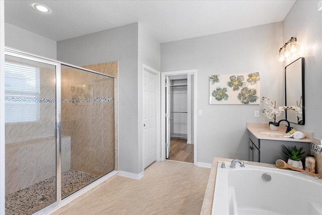 2781 Sand Oak Loop, Apopka, FL 32712 - full bathroom featuring a shower stall, a bath, vanity, a spacious closet, and recessed lighting