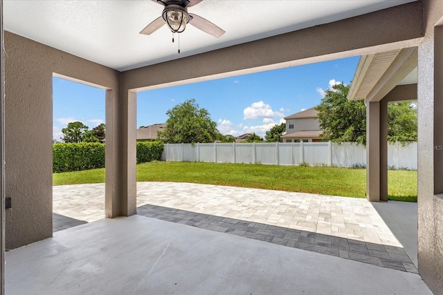 2781 Sand Oak Loop, Apopka, FL 32712 - fenced backyard with a ceiling fan and a patio area