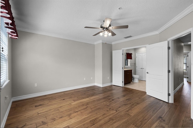 4244 Messina Dr, Lake Mary, FL 32746 - unfurnished bedroom with dark wood-style flooring, a textured ceiling, ensuite bath, ornamental molding, and a ceiling fan