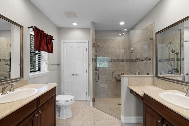 4244 Messina Dr, Lake Mary, FL 32746 - bathroom with two vanities, a stall shower, tile patterned flooring, and recessed lighting