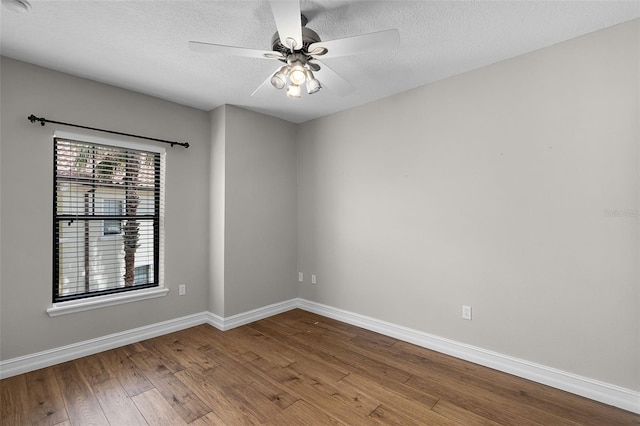 4244 Messina Dr, Lake Mary, FL 32746 - unfurnished room with wood finished floors, a textured ceiling, and a ceiling fan