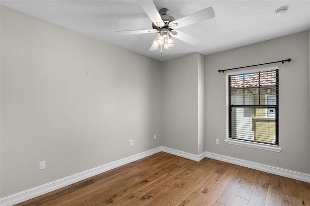 4244 Messina Dr, Lake Mary, FL 32746 - empty room featuring hardwood / wood-style floors, a textured ceiling, ceiling fan, and a smoke detector