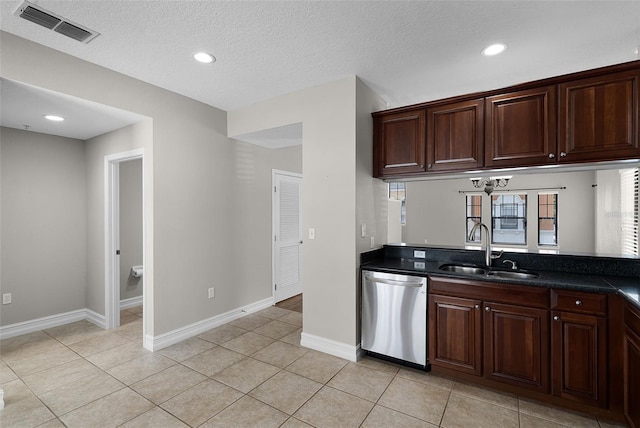 4244 Messina Dr, Lake Mary, FL 32746 - kitchen with dishwasher, dark countertops, light tile patterned floors, recessed lighting, and dark brown cabinets